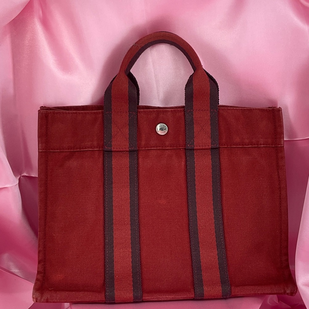 Hermès Fourre Tout PM tote bag in red canvas with black and red striped handles